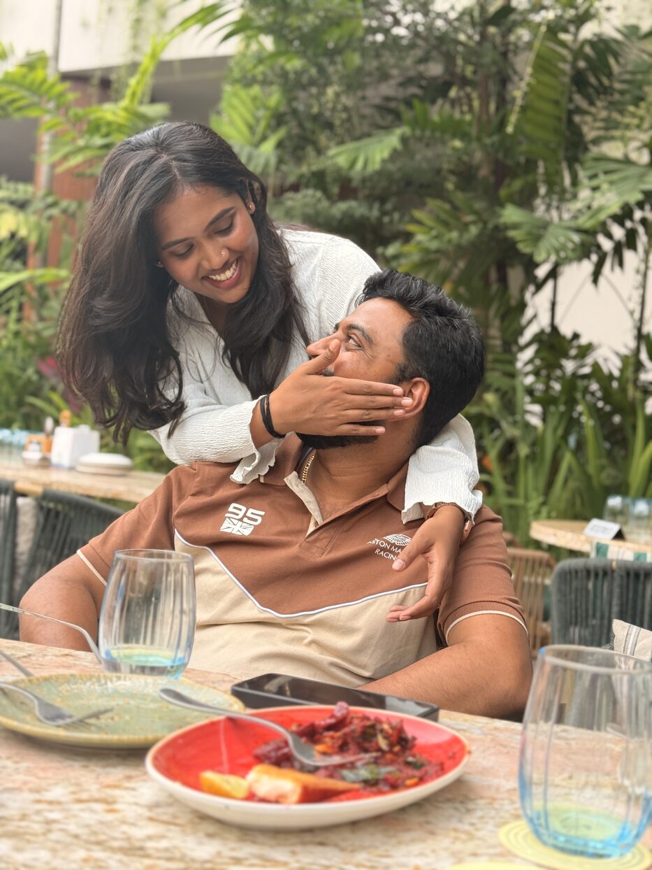 Navya playfully covering Subramanya's face at a restaurant